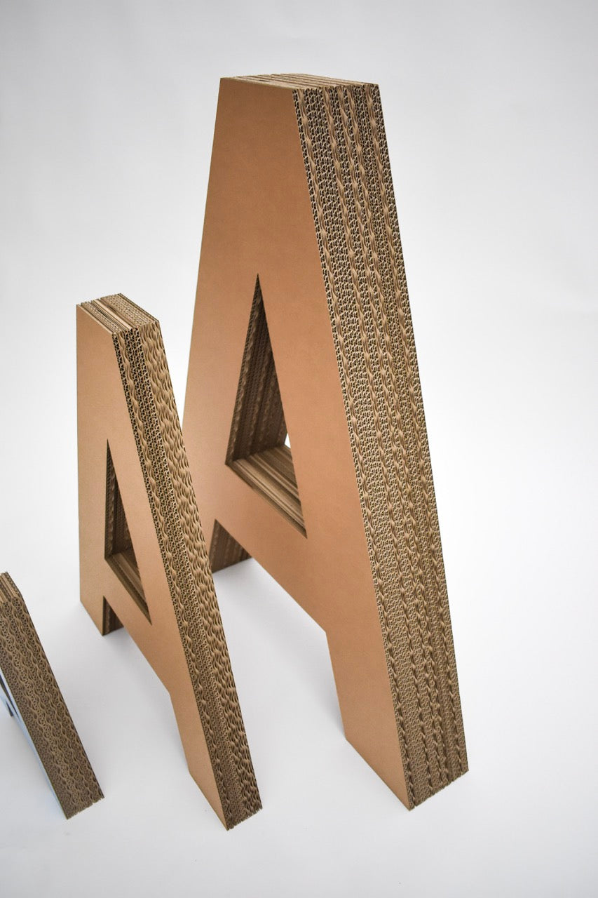 Cardboard layered letters and numbers